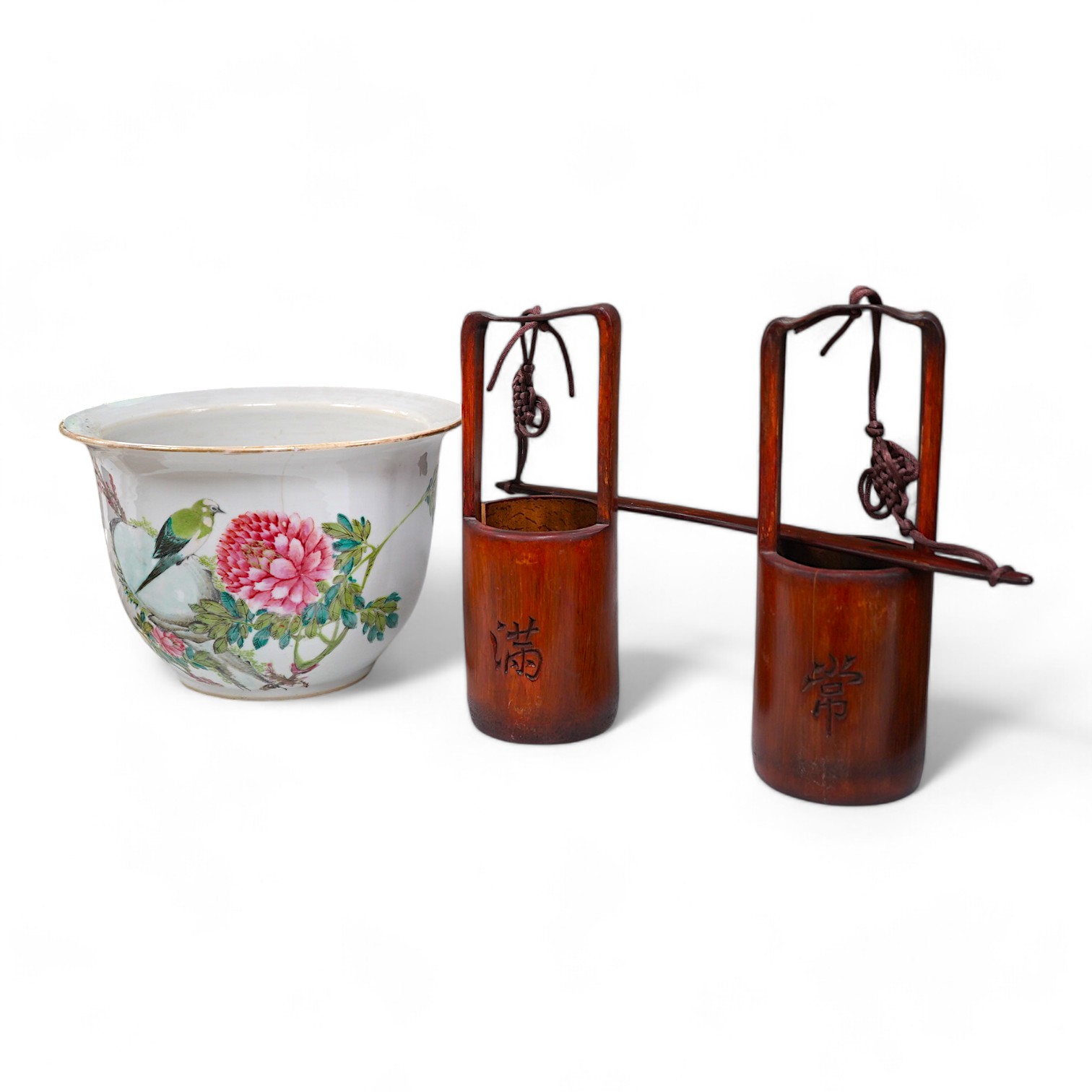 A Chinese famille rose jardiniere and bamboo oak rail, famille rose jardiniere 27cm diameter. Condition - jardiniere cracked from rim and restored, bamboo side cracked